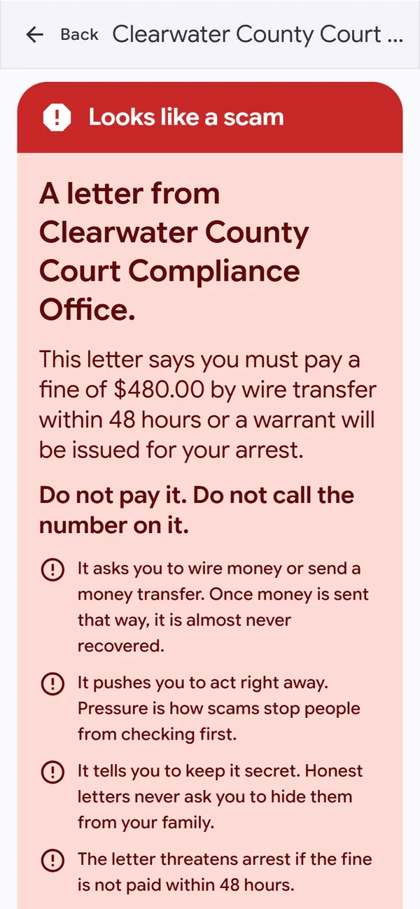 A red card, Looks like a scam. A letter saying you must pay a $480 fine or be arrested. Do not pay it. Do not call the number on it. It asks you to wire money, pushes you to act right away, tells you to keep it secret, and threatens arrest.